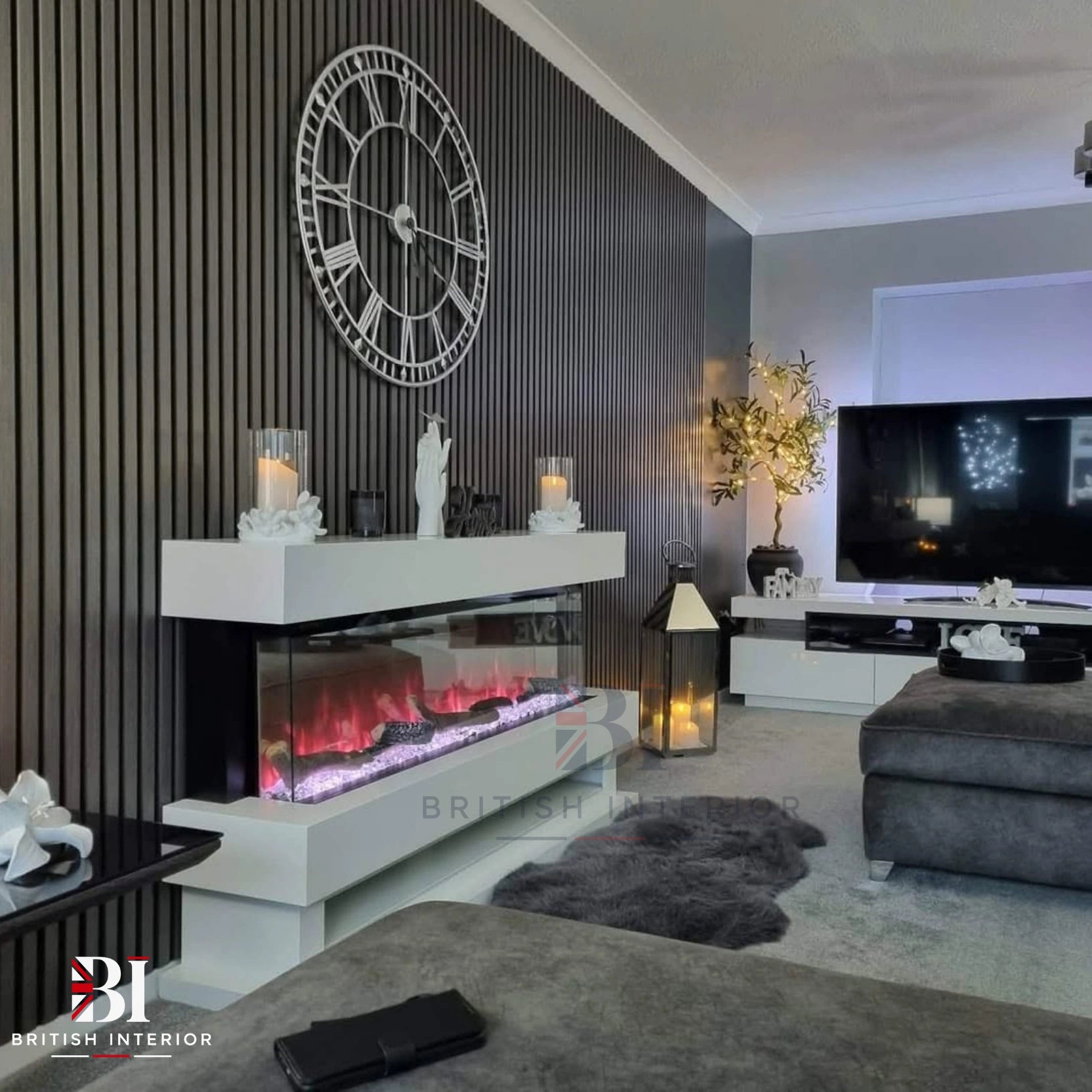 Grey oak acoustic slat wall panels behind a television in a modern living room