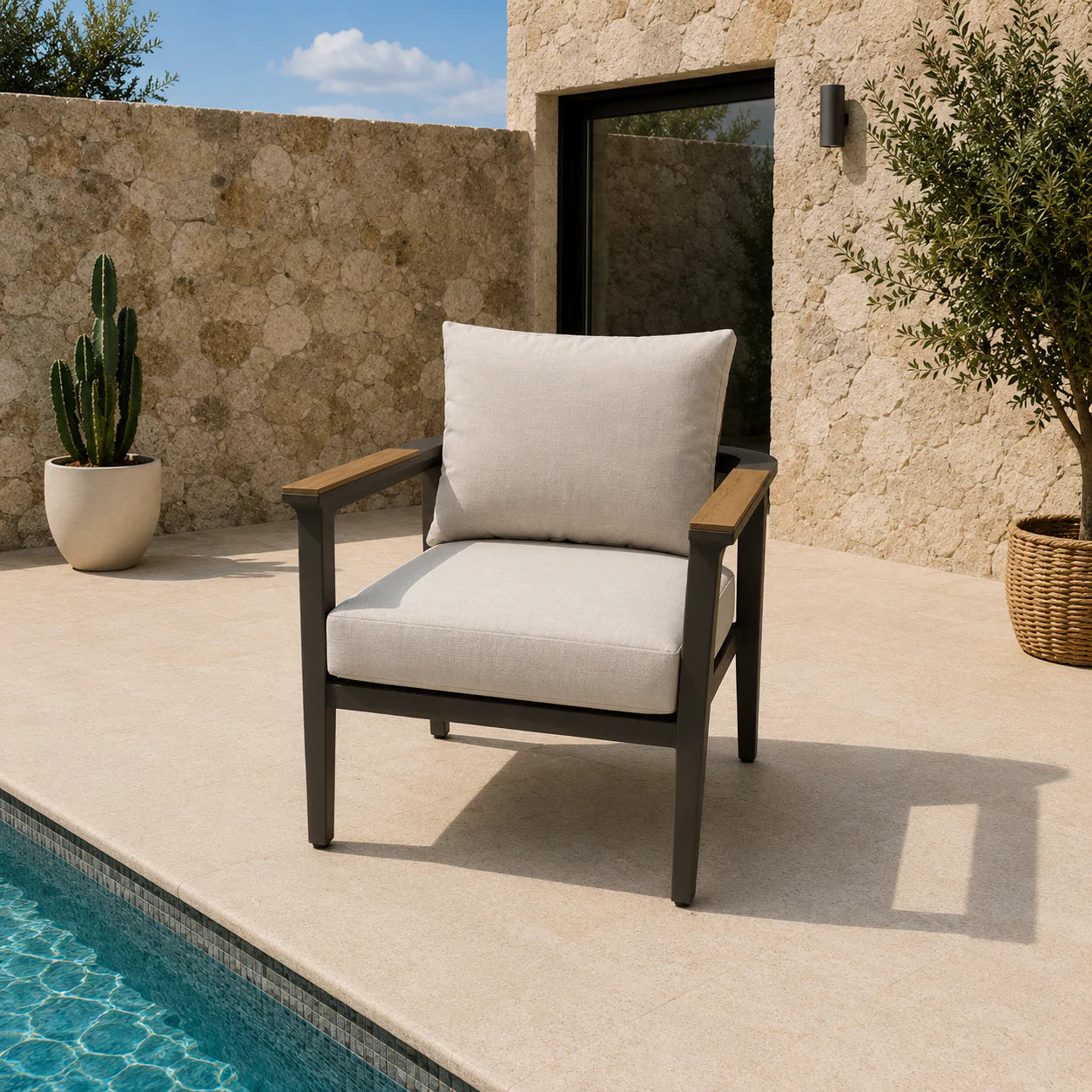 Chair with white cushion by a poolside in an outdoor setting