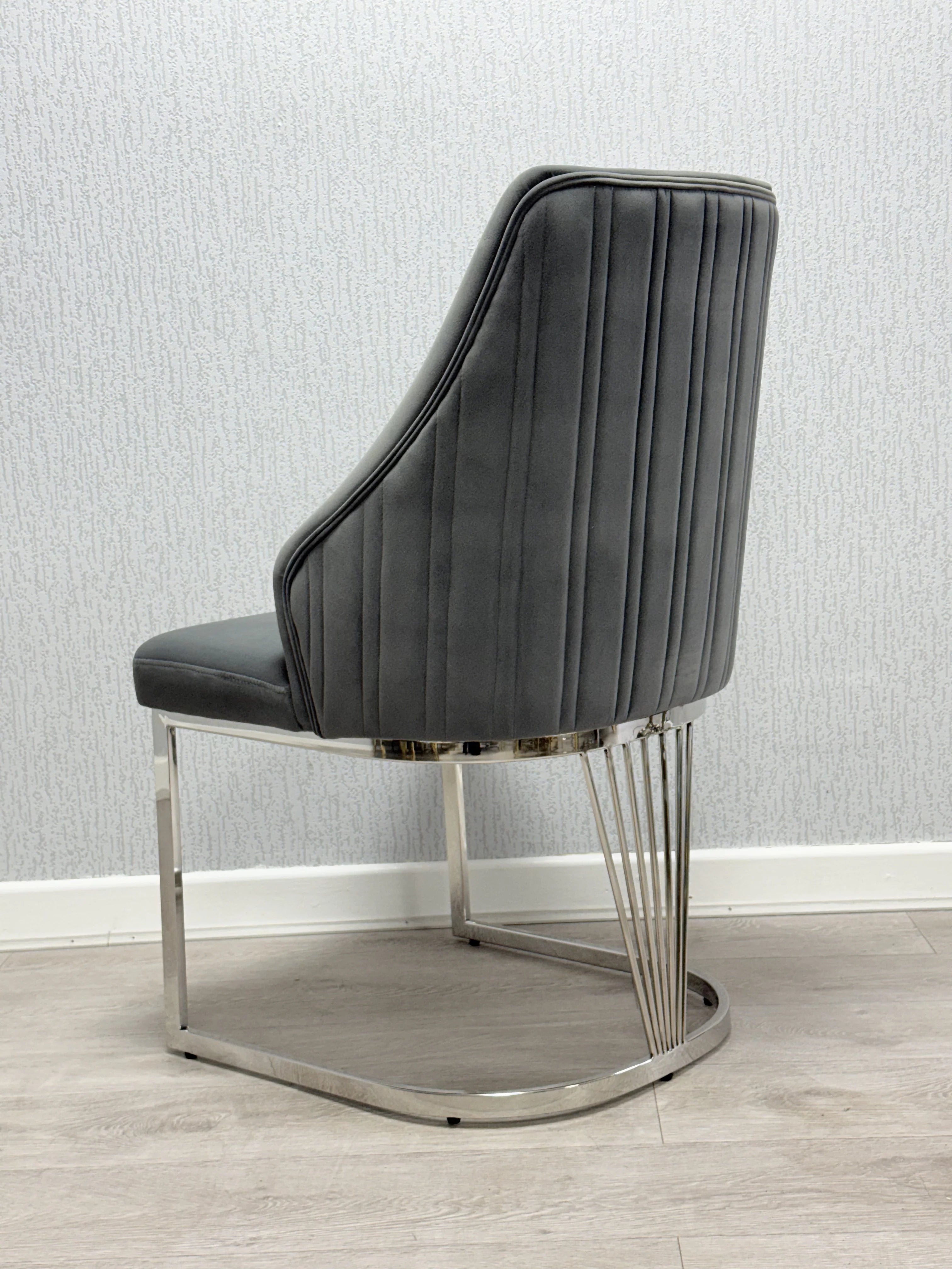 Premium dining furniture featuring a grey marble tabletop and Lasco Grey chairs for luxury Newcastle homes.