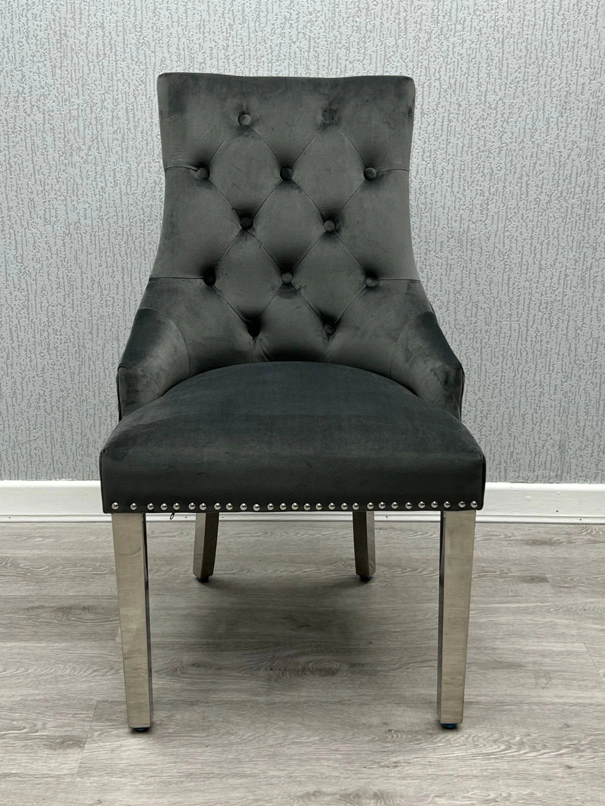 Luxury home furniture for Oxford interiors with a sophisticated grey marble dining table and Majestic Lion Knocker chair design.
