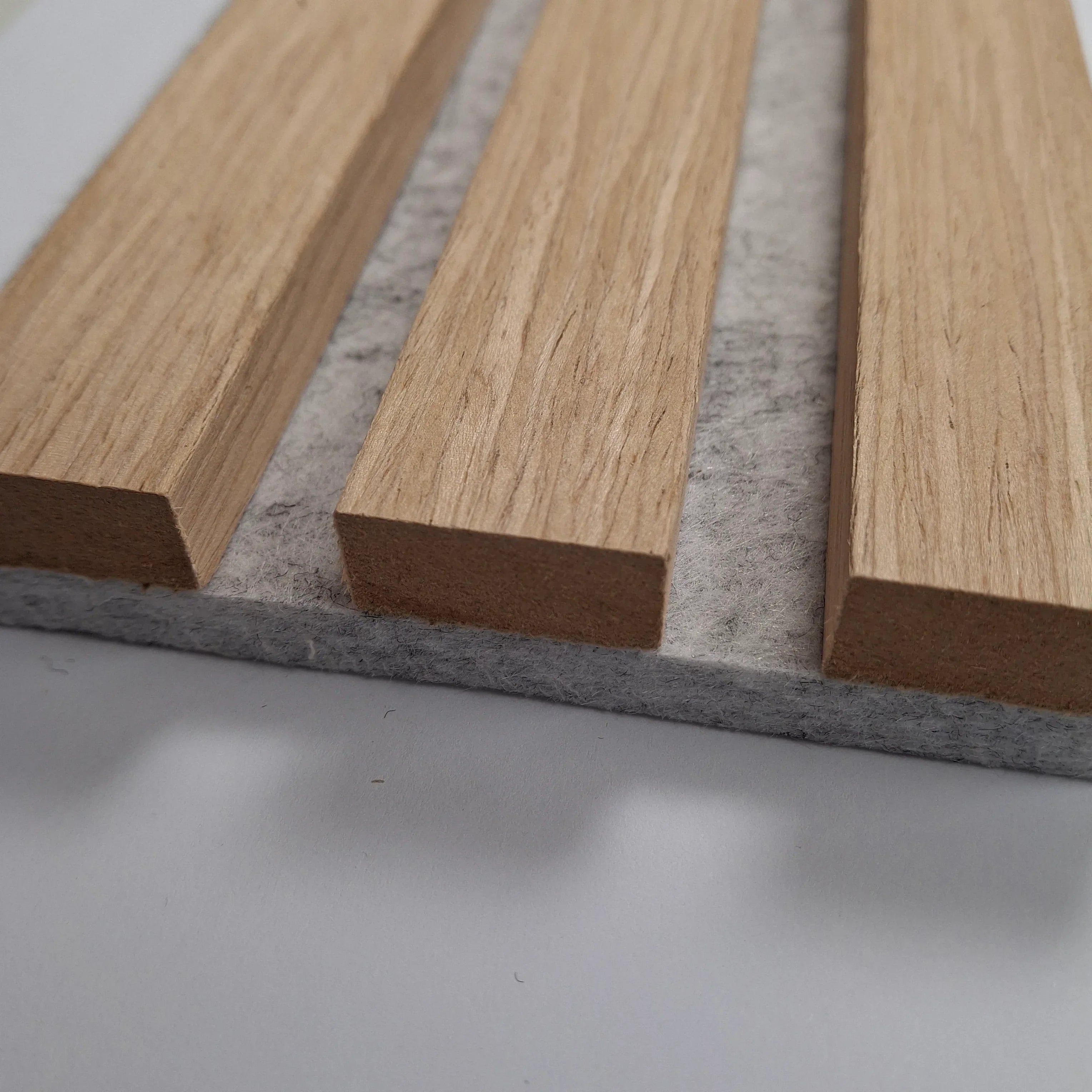 Oak acoustic slatted wall panel with grey felt backing