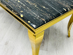 Luxury dining room inspiration for Liverpool homes featuring gold marble detailing, elegant upholstered chairs, and a dramatic contemporary aesthetic.