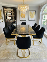 Ravello 180cm black and gold marble dining table set with elegant Lasco chairs, creating a sophisticated focal point for modern UK dining interiors.