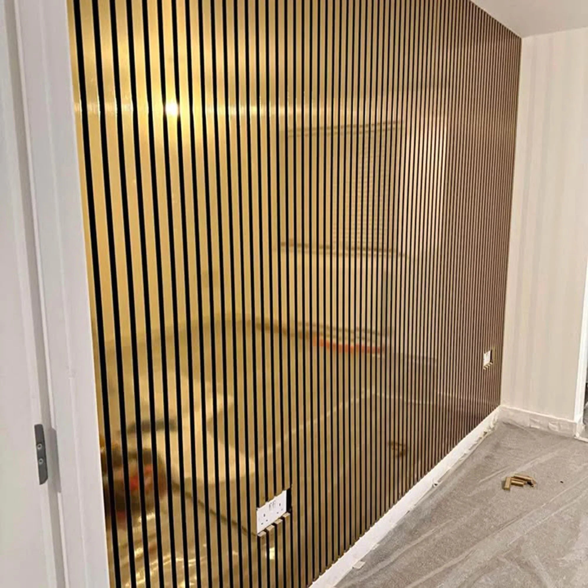 Shiny gold acoustic panels used as a contemporary feature wall