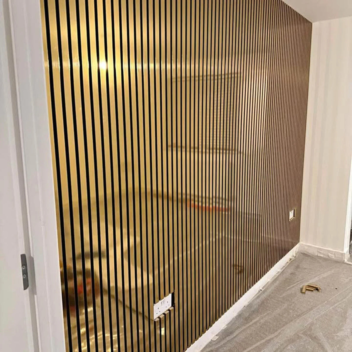 Shiny gold acoustic panels used as a contemporary feature wall