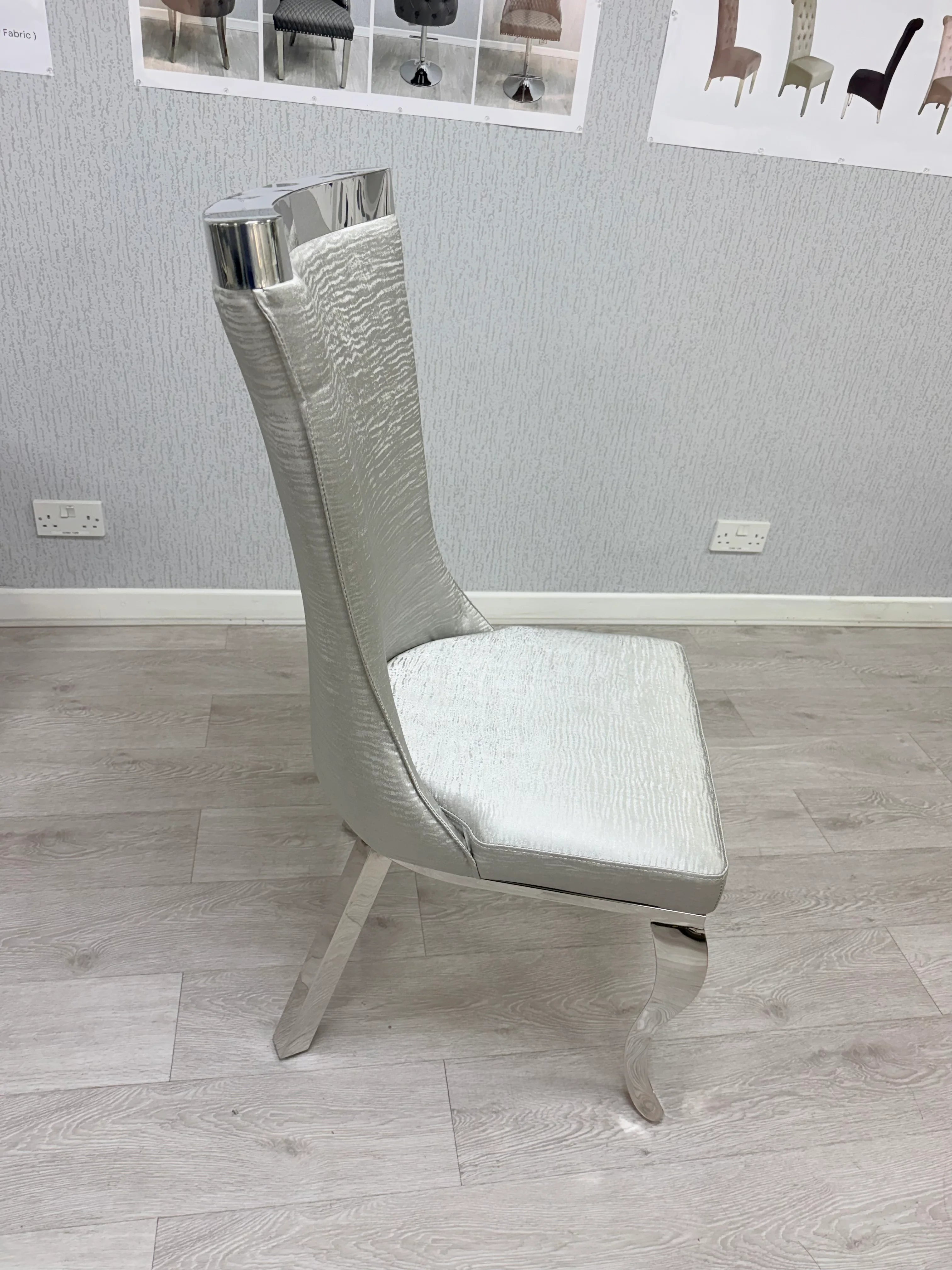 Grey fabric upholstered dining chair designed for comfort and luxury interiors