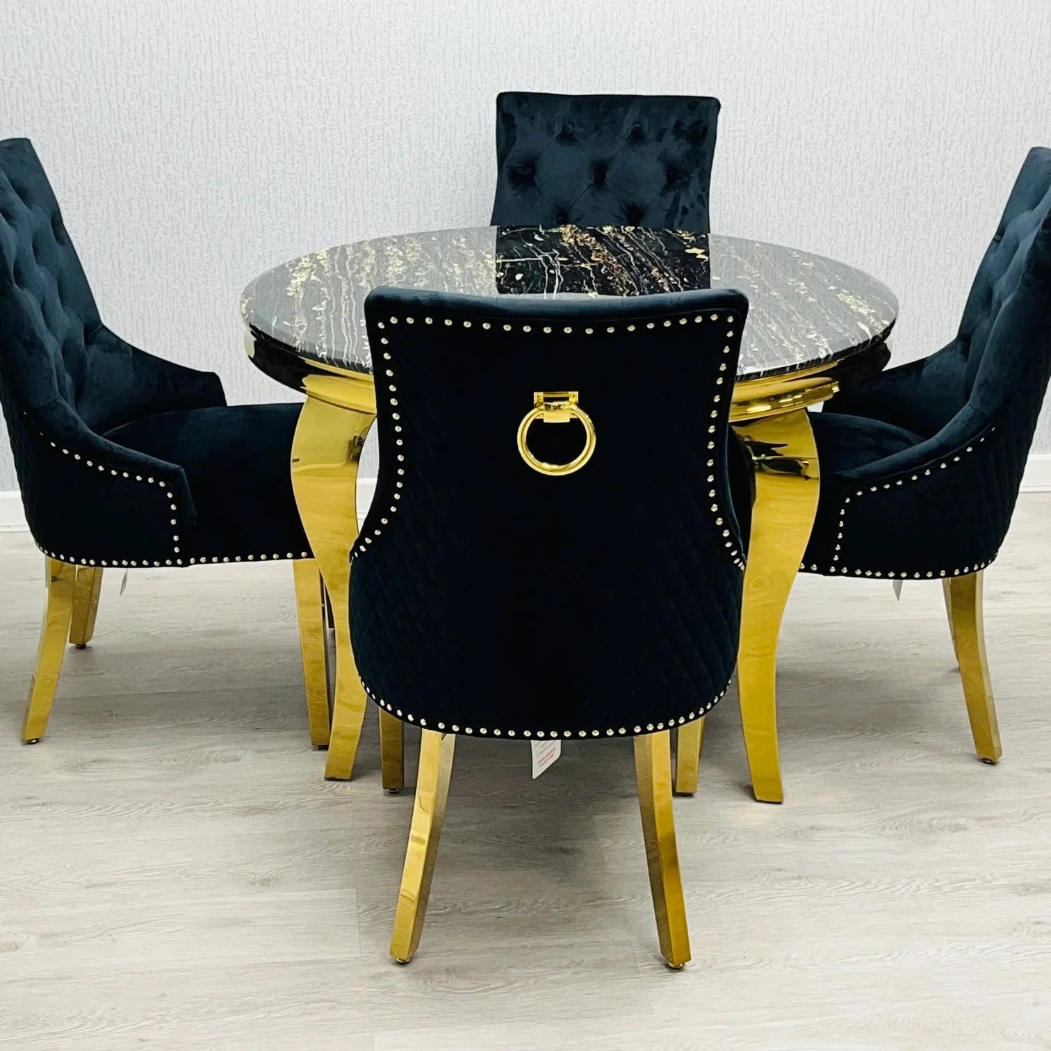Sofia Black Gold Marble Dining Table with Majestic Black Gold Lion Knocker Chairs luxury dining set for premium homes in London, Manchester and Birmingham UK