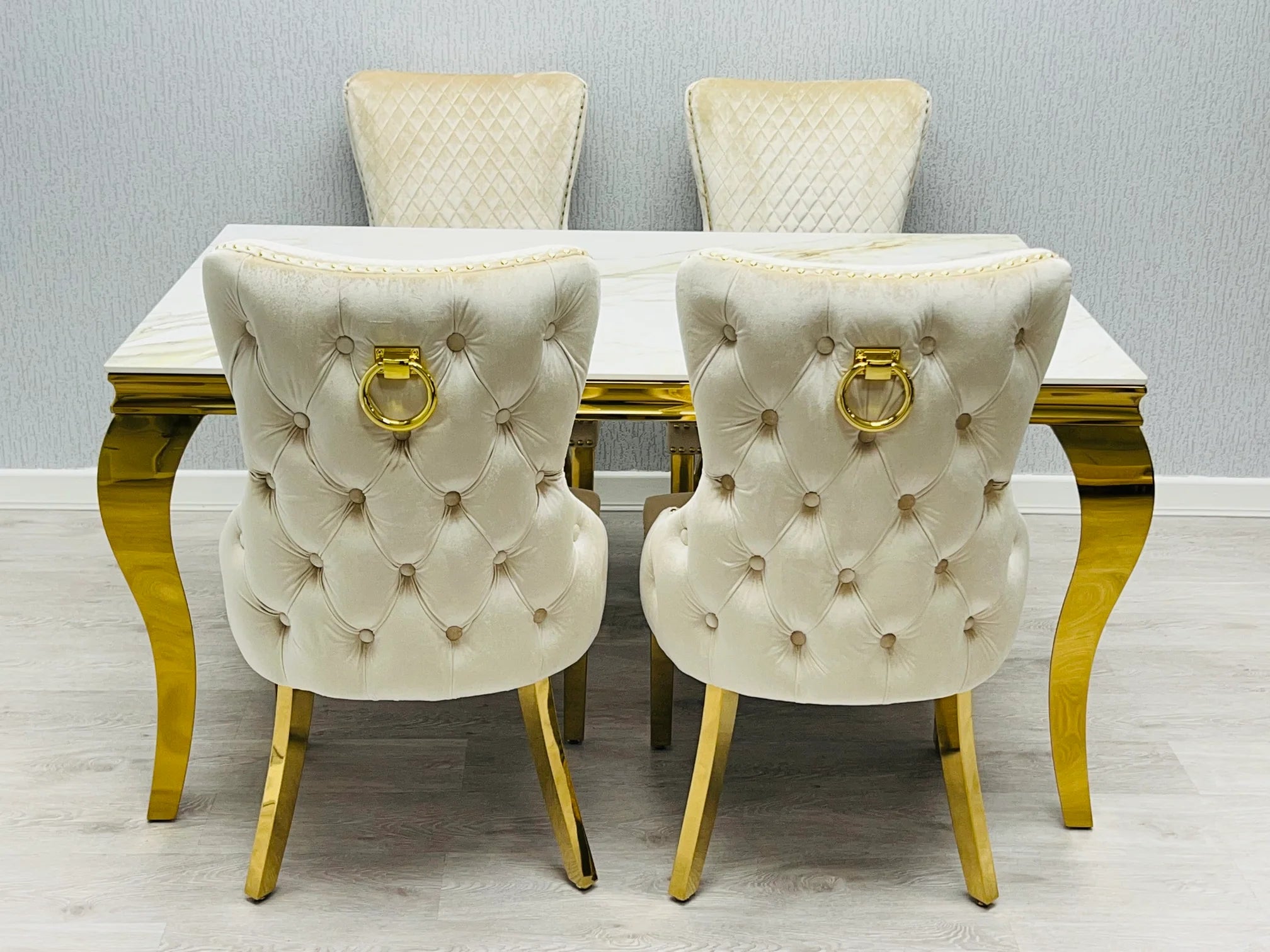 Sofia cream gold marble dining table with Victoria chairs creating an impressive dining space for executive family homes in Wilmslow, Hale Barns and Knutsford UK