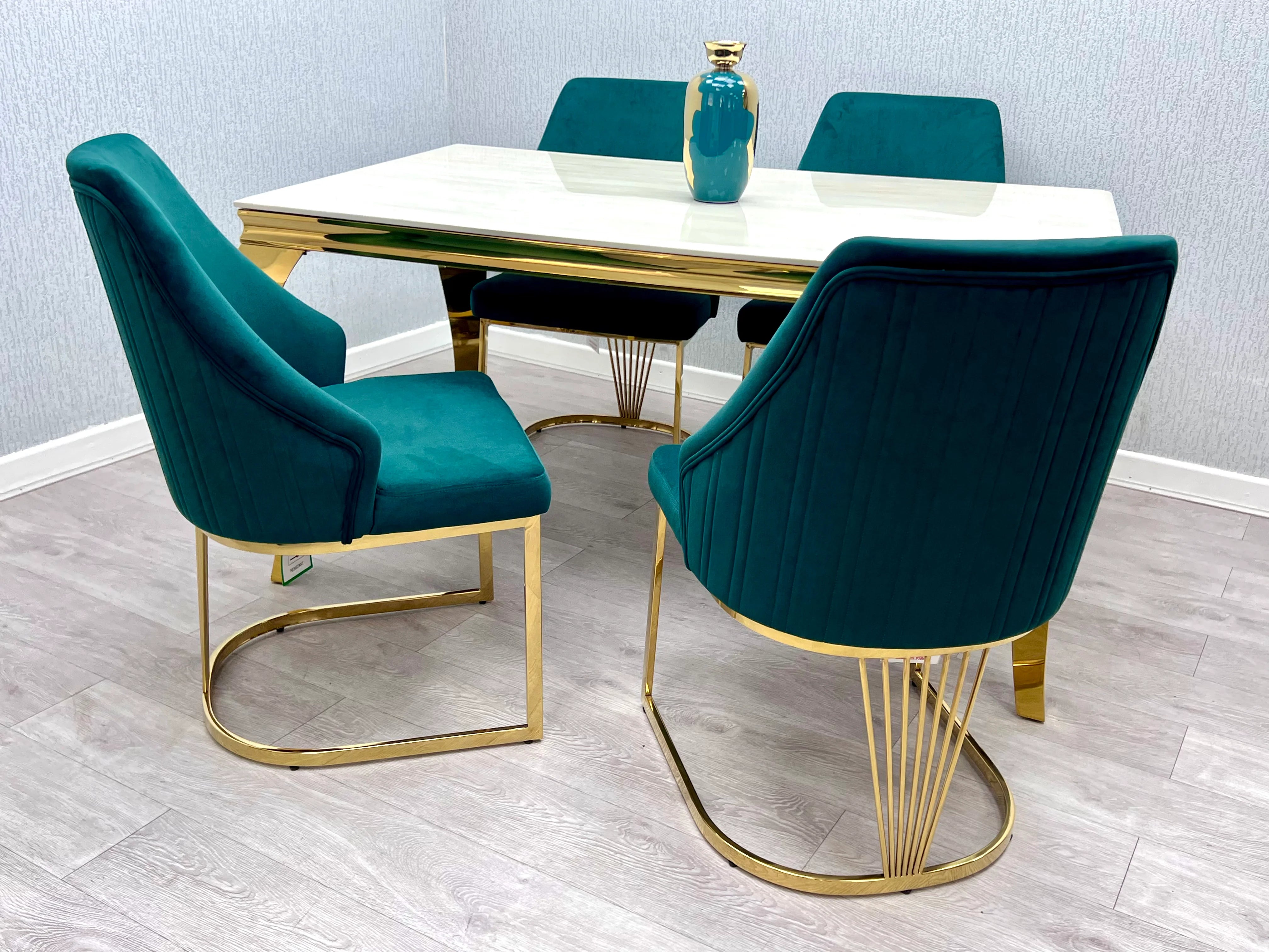 A statement piece for Liverpool premium properties, featuring a cream marble surface, gold accents, and elegant upholstered chairs for luxury entertaining.