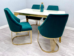 A statement piece for Liverpool premium properties, featuring a cream marble surface, gold accents, and elegant upholstered chairs for luxury entertaining.
