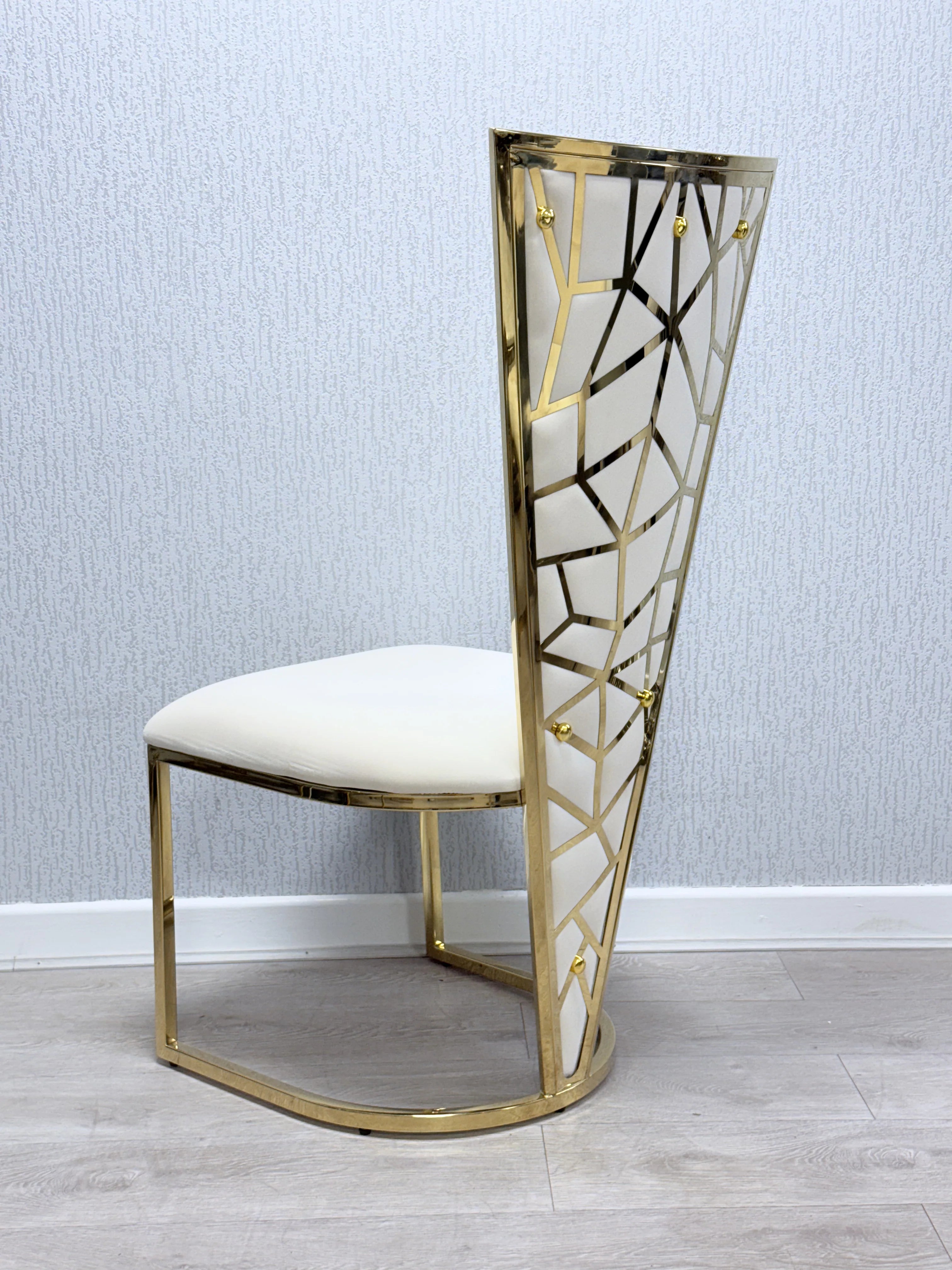 Modern marble dining suite featuring Sofia cream gold table with Vienna chairs for luxury homes in Mayfair