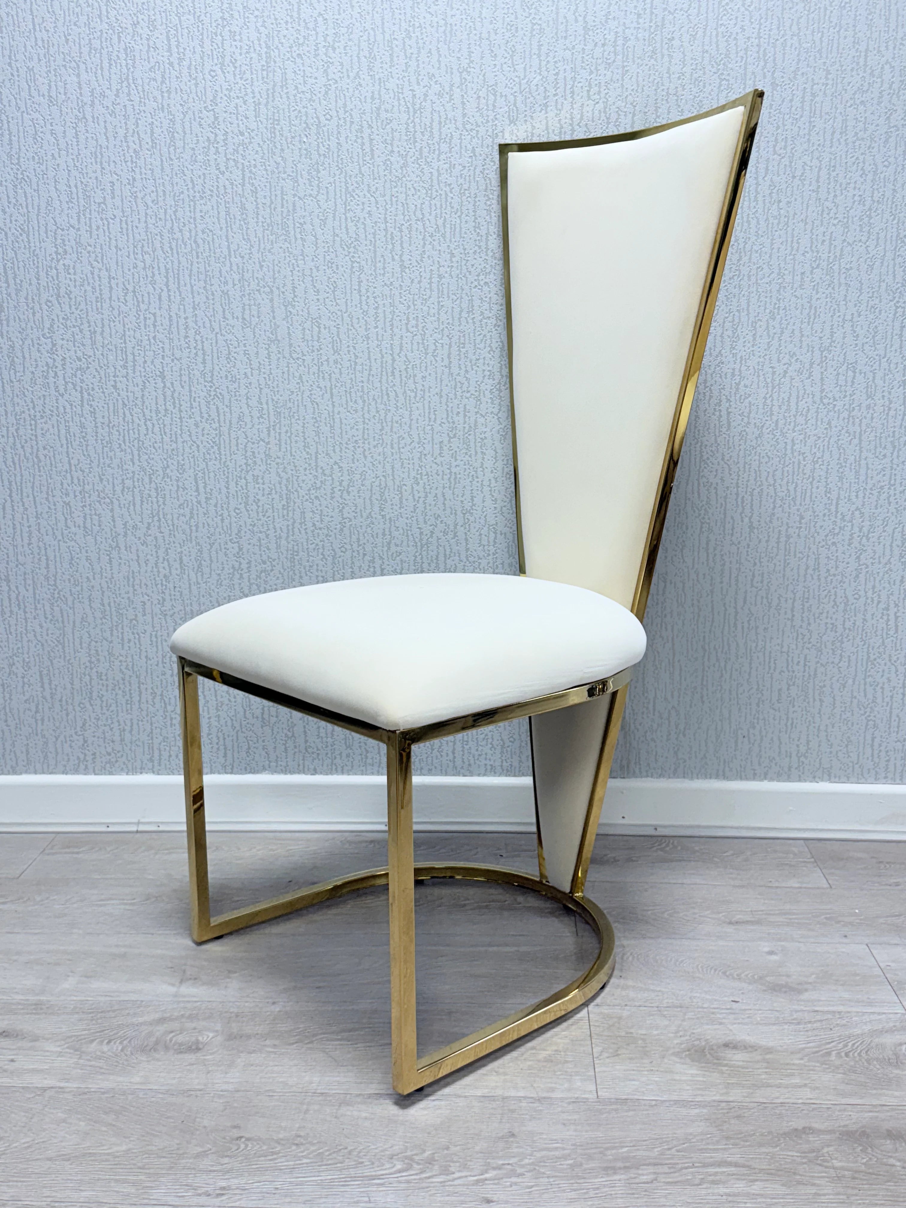 Premium marble dining table with cream gold finish and Vienna chairs for elegant dining room furniture in Kensington