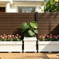 Walnut composite fence panels installed in a garden