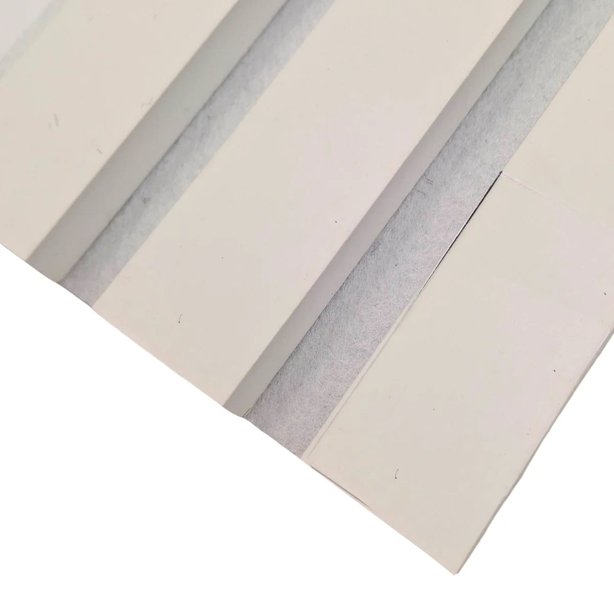 Close-up of white acoustic slats with white felt backing
