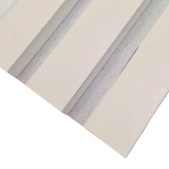 Close-up of white acoustic slats with white felt backing