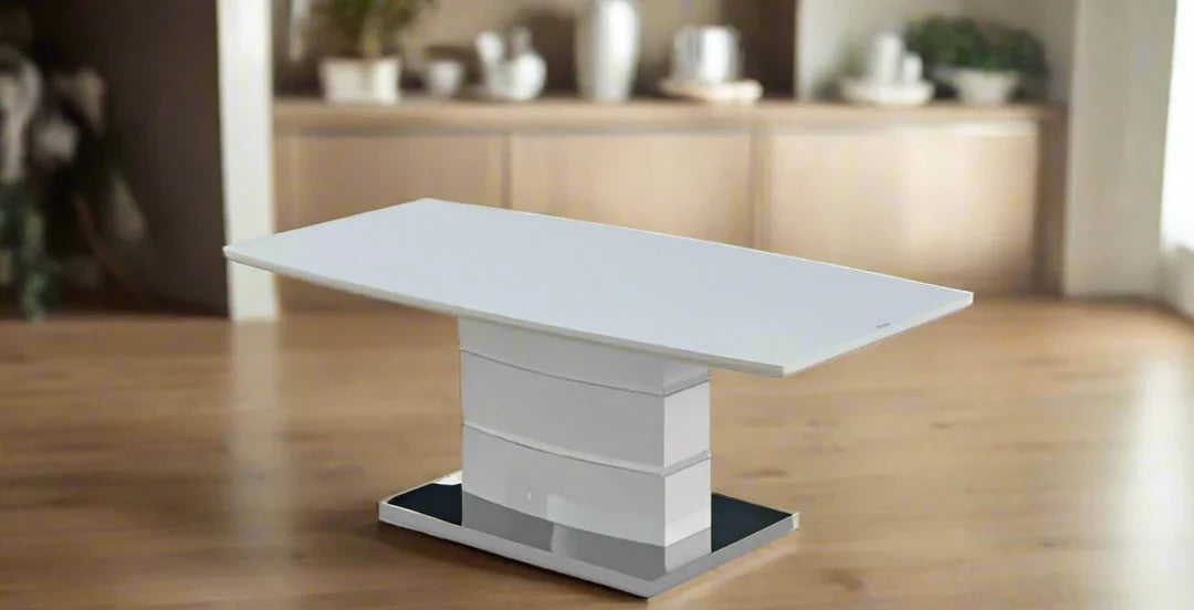 White coffee table with glass top creating a stylish centrepiece for a modern lounge.